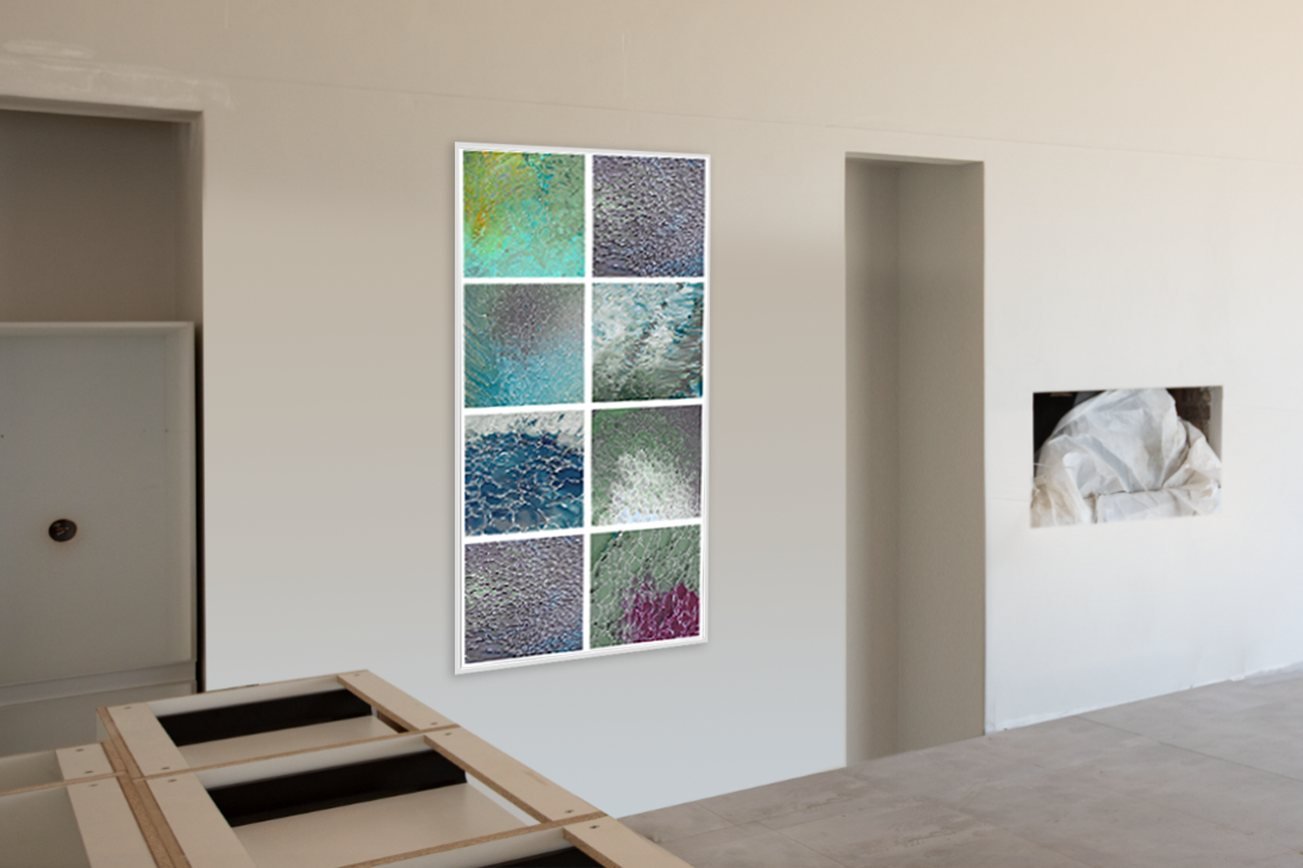 A mock-up of a large eight panel artwork on a bare wall during construction